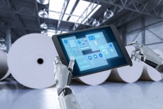 AI looking at production data in front of large paper reams